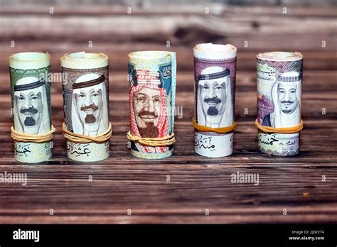 Saudi Arabia Money Roll Riyals Banknotes Isolated On Wooden Background