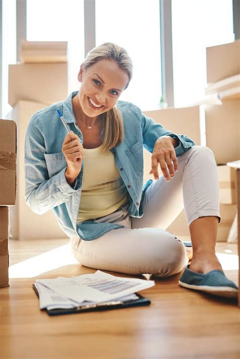Last Box Packed Check Portrait Of A Mature Woman Going Through Paperwork On Moving Day Stock