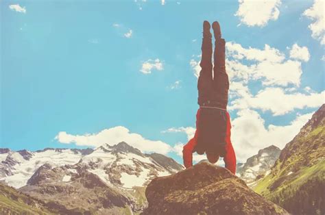 Practice Gymnastic Exercises In The Open Air In Nature Stuntman Doing