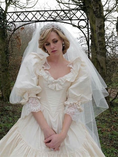 A Woman Wearing A Wedding Dress And Veil