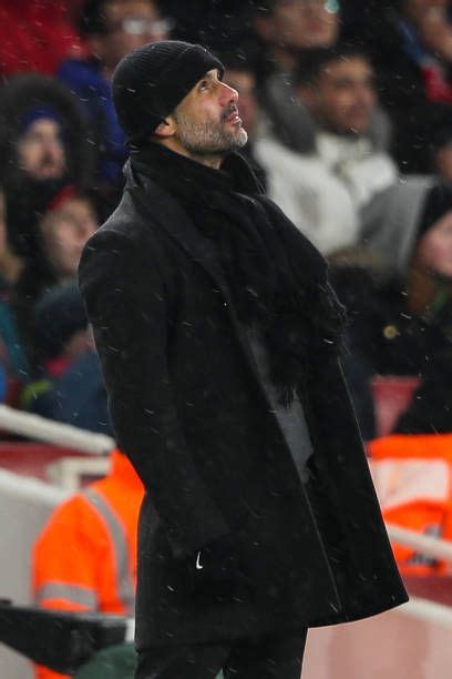 Pep Guardiola The Head Coach Manager Of Manchester City Looks On