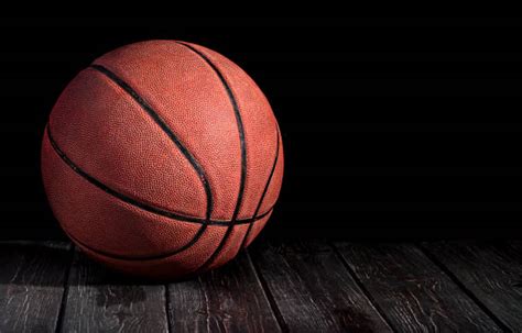 70 Basketball On Hardwood Court Floor With Spot Lighting Stock Photos