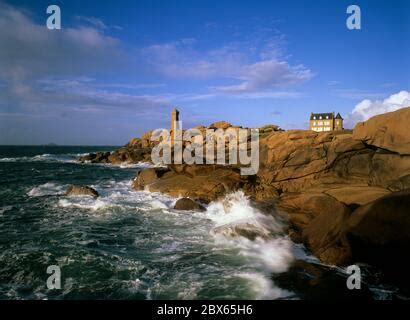 lighthouse  stormy sea   pink granite coast ploumanach