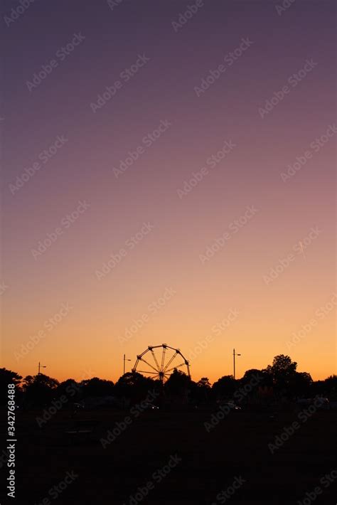 Beautiful and vibrant sunset, with the colours changing from a pink ...