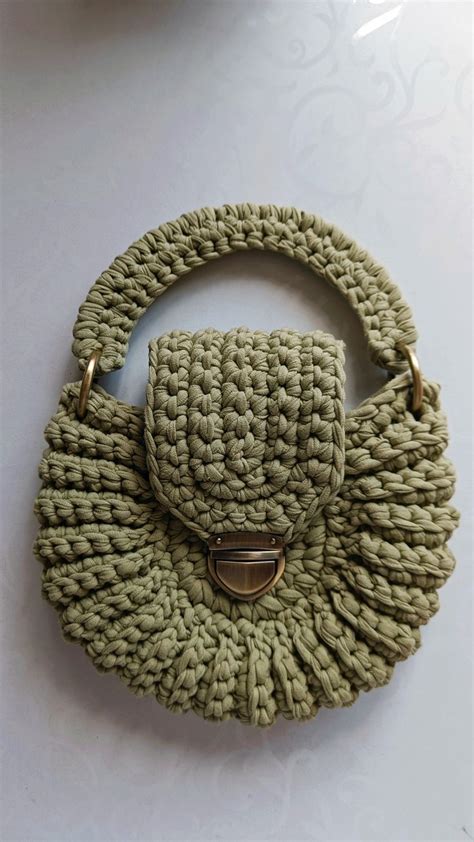 a crocheted purse sitting on top of a table
