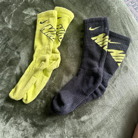 Nike socks, black and neon green, used - Depop