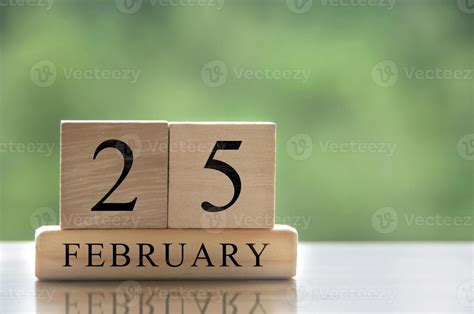 February 25 calendar date text on wooden blocks with customizable space ...