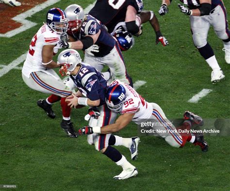 New York Giants' defensive end Michael Strahan sacks New England ...