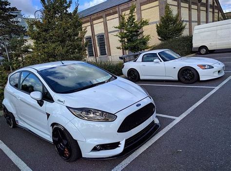 Two White Ford Fiesta Hatchbacks