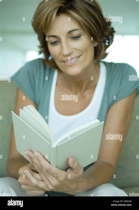 Mature Woman Reading Book Stock Photo Alamy
