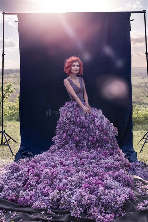 Beautiful Woman With Lilac Dress At The Beach Background Portrait