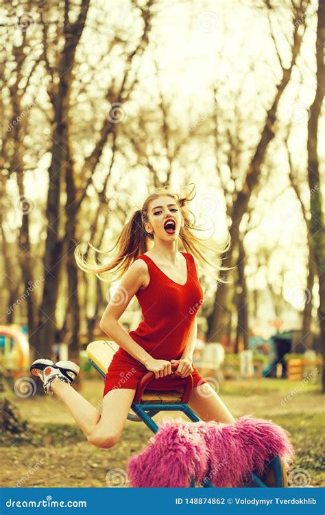 Playful Woman On Swing Stock Photo Image Of Outdoor 148874862