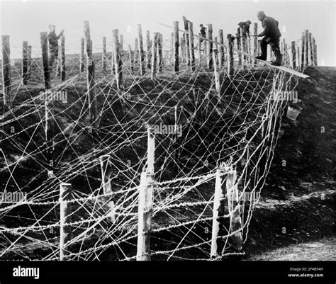 German Soldiers Fixing A Barbed Wire Entanglement During World War I Ca