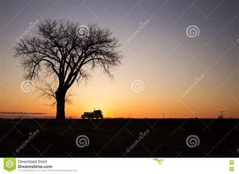 Silhouette of One Tree and Semi Truck at Sunset Stock Photo - Image of ...