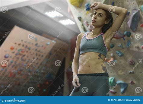 Athletic Woman With Muscular Naked Torso Is Training In Climbing Gym