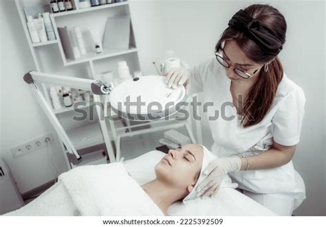 Skincare Treatment Dermatologist Carefully Examines Clients Stock Photo