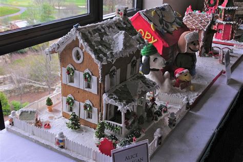 A Gingerbread House Decorated For Christmas With Decorations On The