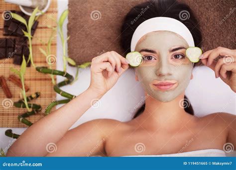 Spa Beautiful Young Woman Is Getting Facial Clay Mask At Spa L Stock