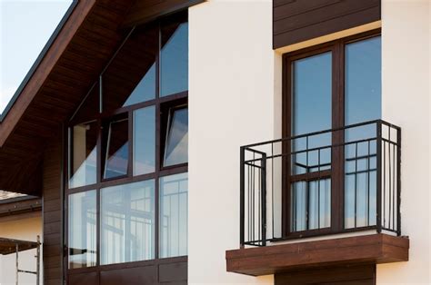 Premium Photo Brown Windows With A European Style Balcony In A