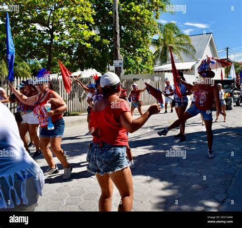 Carnival goers dancing and having fun in the San Pedro, Belize, Carnival 2022 parade. Blue, red ...