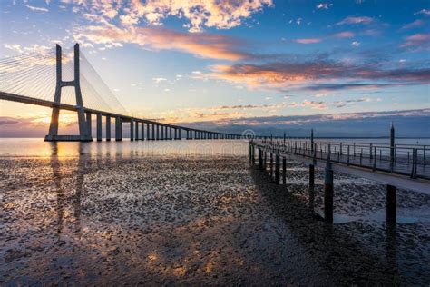 Vasco Da Gama Bridge at Sunrise in Lisbon, Portugal. Vasco Da Gama Bridge is a Cable-stayed ...