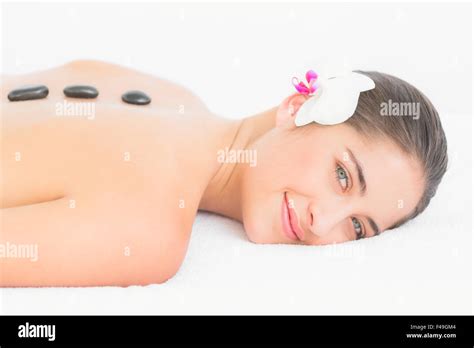 Pretty Woman Enjoying A Hot Stone Massage Stock Photo Alamy