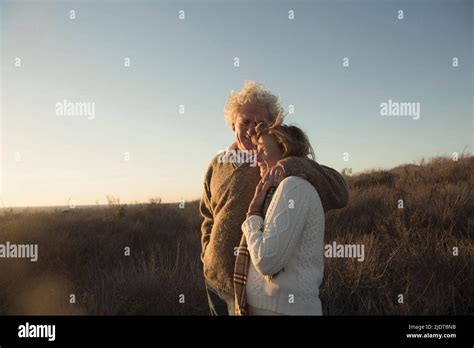 Older Caucasian Couple Hugging Outdoors Stock Photo Alamy