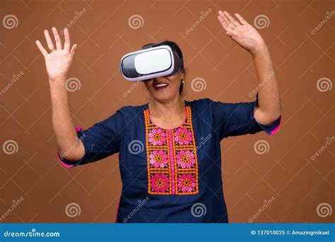 Mature Indian Woman Using VR Glasses For Virtual Reality Stock Image Image Of Clothing Happy