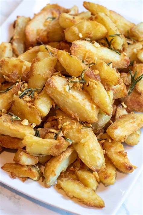 Crispy Garlic Rosemary Potato Wedges Served From Scratch