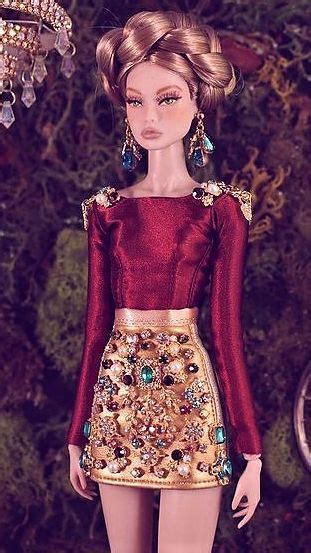 A Barbie Doll Wearing A Red And Gold Dress