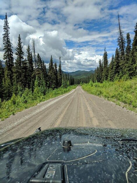 Premium Photo Road Amidst Trees Against Sky