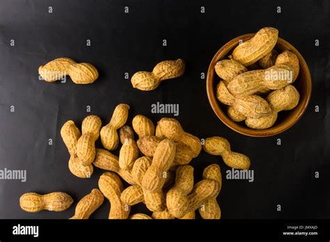 Peanuts Arachis Hypogaea In Shell On Dark Background Close Up