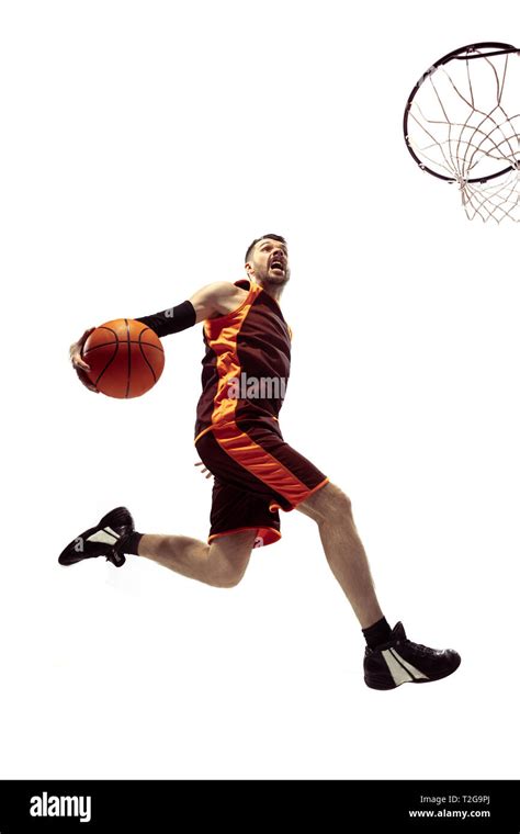 Full length portrait of a basketball player with ball isolated on white ...