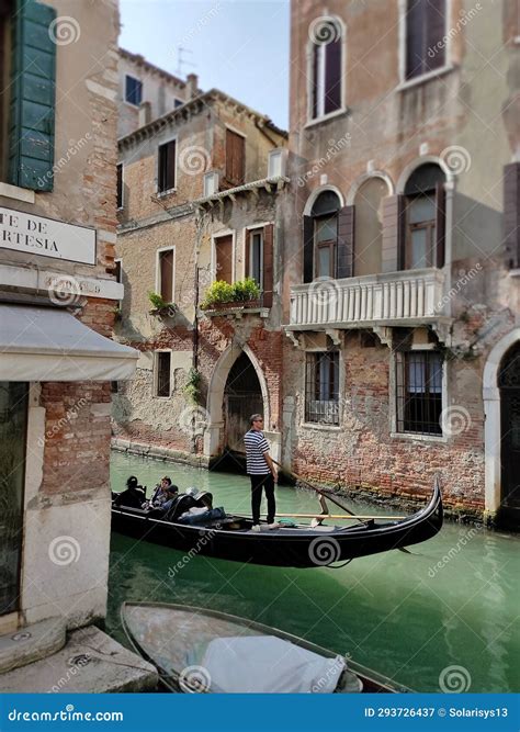 Venice, Italy - October 5, 2023: Tourists Floating in a Gondola in