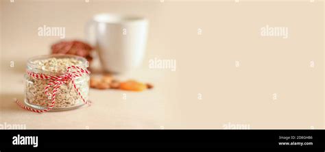 Homemade Delicious Oatmeal Flakes In A Glass Open Jar With Dried