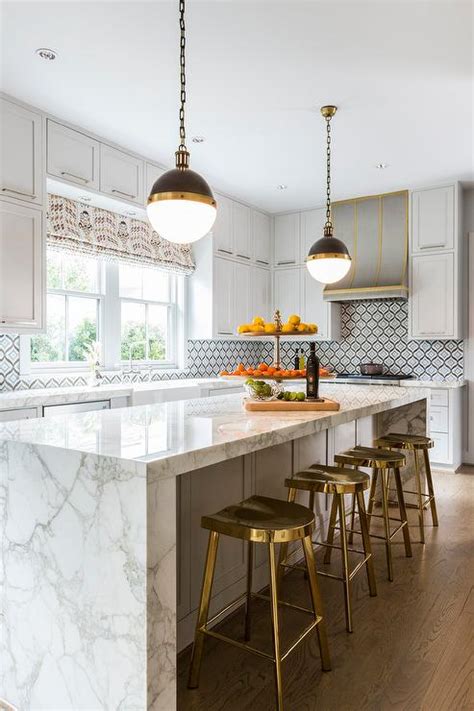 Gold Counter Stools At White And Gray Marble Waterfall Island