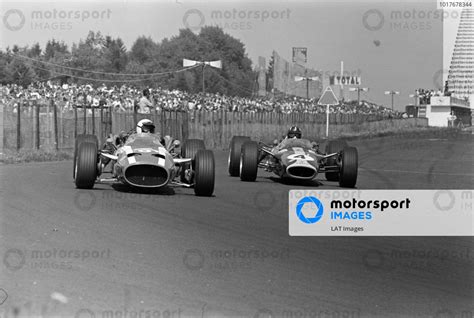 Jo Bonnier Cooper T81 Maserati Leads Graham Hill Lotus 49 Ford