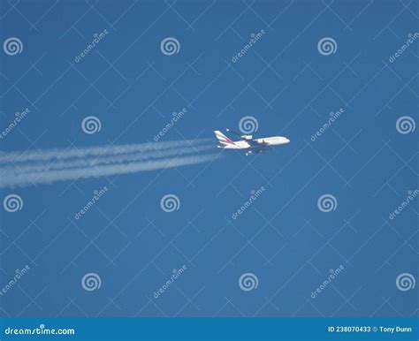 Telephoto Side View Of Passenger Jet Flying At High Altitude Editorial