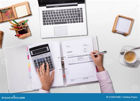 Accountant Calculating Invoice In Office Royalty Free Stock Image