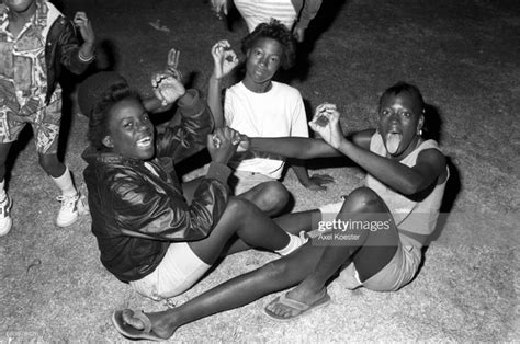 Members of the Grape Street Crips pose "throwing" their signature 'G ...