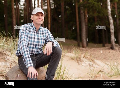 Mature Man Resting Against Pine Forest Stock Photo Alamy