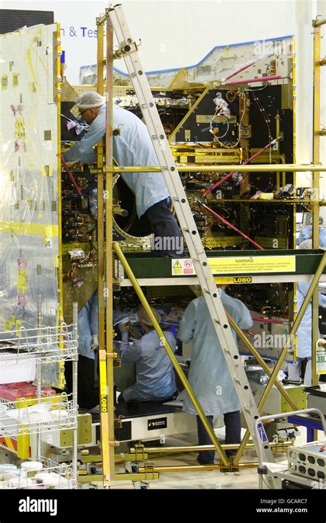 Engineers Work On An Astra Satellite In The Neptune Clean Room At