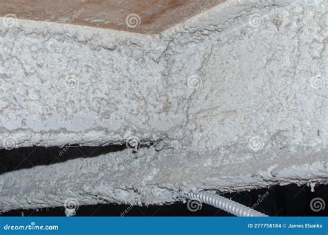 Asbestos Containing Spray On Insulation Above Ceiling Stock Photo