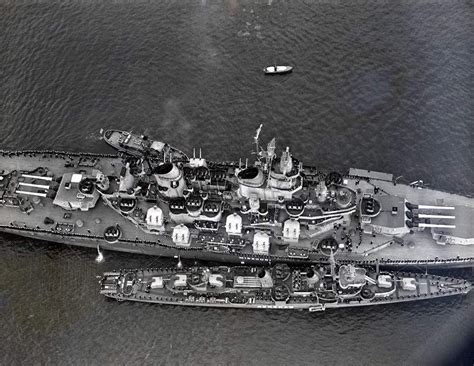 The size difference between a Battleship and a Destroyer. USS Renshaw alongside the USS Missouri ...