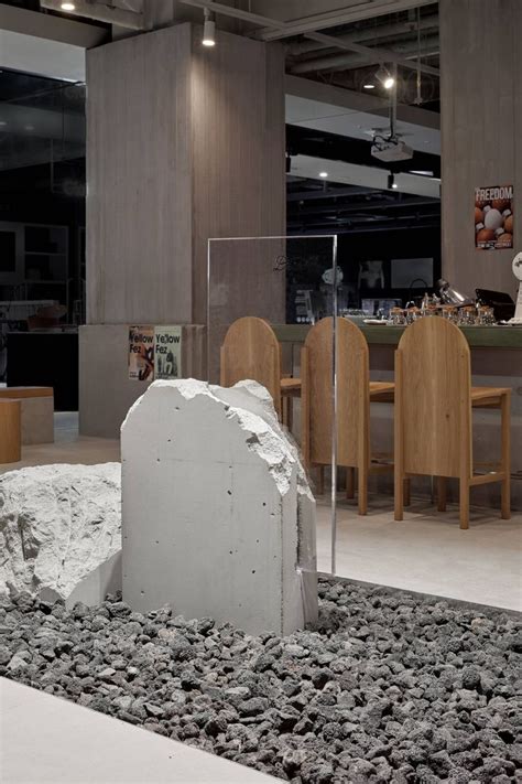 A Large Rock Sitting On Top Of A Pile Of Rocks In Front Of A Bar