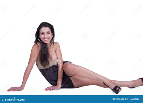 Fashion Woman With Long Brunette Hair Wear Short Neckline Dress And Black High Heels Stock Photo