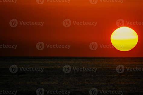 Sunset scene by the ocean 14787406 Stock Photo at Vecteezy