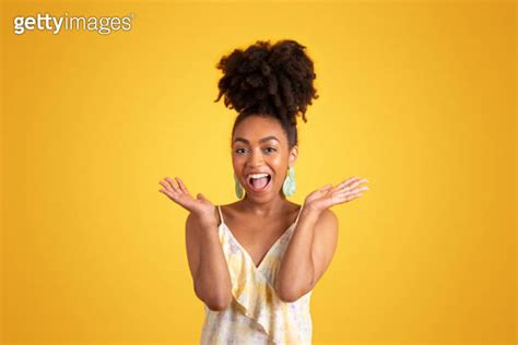 Glad Excited Shocked Millennial African American Lady In Dress Spreads