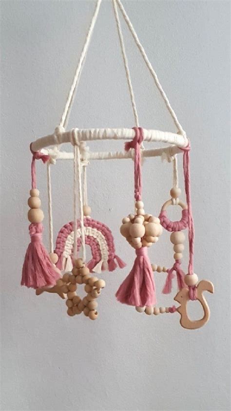 A Mobile With Wooden Beads And Tassels Hanging From It