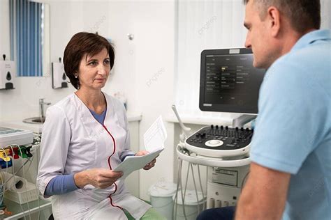 Cardiologist Conducts Health Checkup With Ultrasound In Clinic Photo